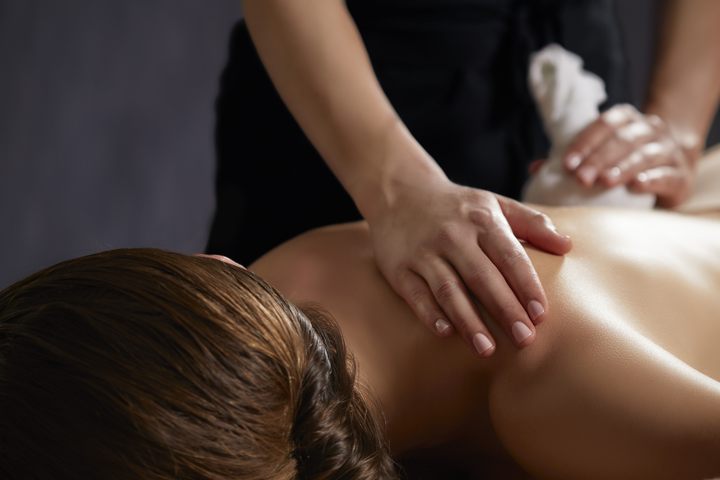 Women receiving a Poultice massage.