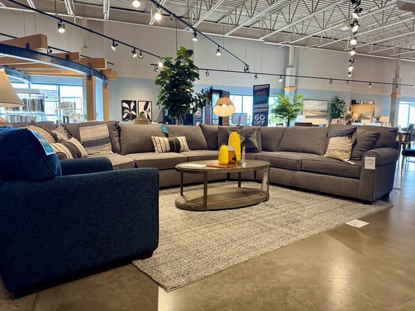 Woodbury Slumberland Furniture L-shaped sectional and blue chair