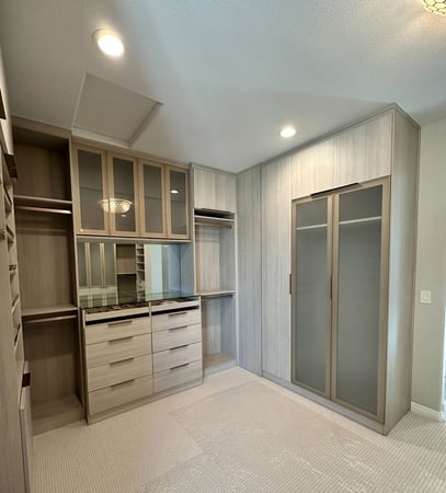 Luxurious walk in closet in Misty Orchard by California Closets San Diego.