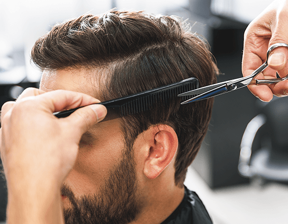 Premium Photo  Hairdresser sealing a strand of dyed hair in foil