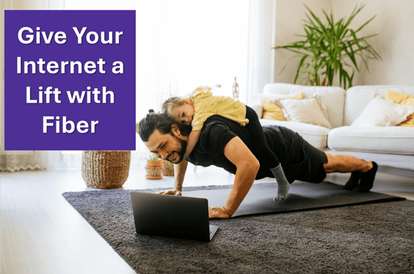 Men doing pushups with a little girl on his back while looking at the laptop