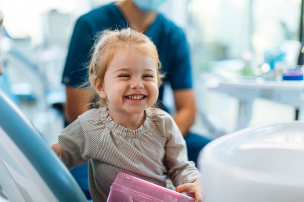 Smiling little girl at the dentist