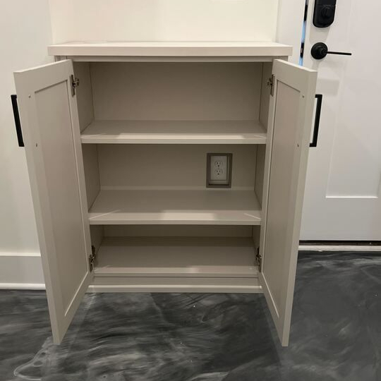Virginia Beach - Custom closets - Compact cabinet with interior shelving and matte black hardware.