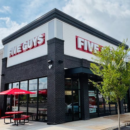 Exterior photograph of the Five Guys restaurant at 1060 Chen Parkway in McDonough, Georgia.