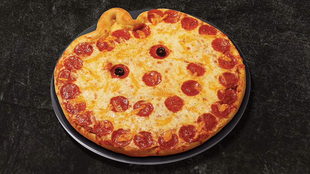 jack-o-lantern shaped pizza with pepperoni