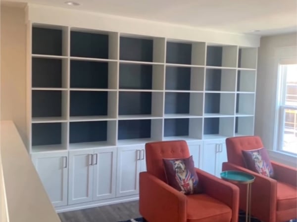 Richmond - Custom closets - Built-in shelving unit across the wall with cabinets along the bottom