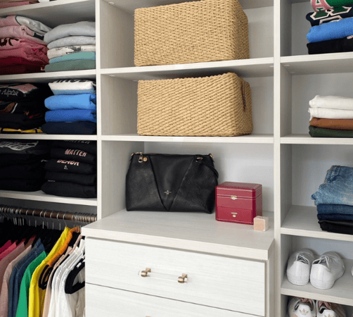 white walk-in closet with drawers, crystal gold hardware, shelving, hanging, and organized baskets for storage Chappaqua New York Westchester County NY