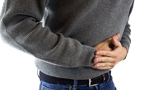 Image: clutching abdomen, abdominal pain
