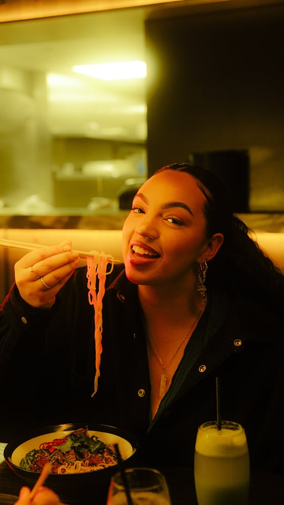 Person eating noodles