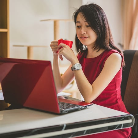 Professional woman looking at her laptop.