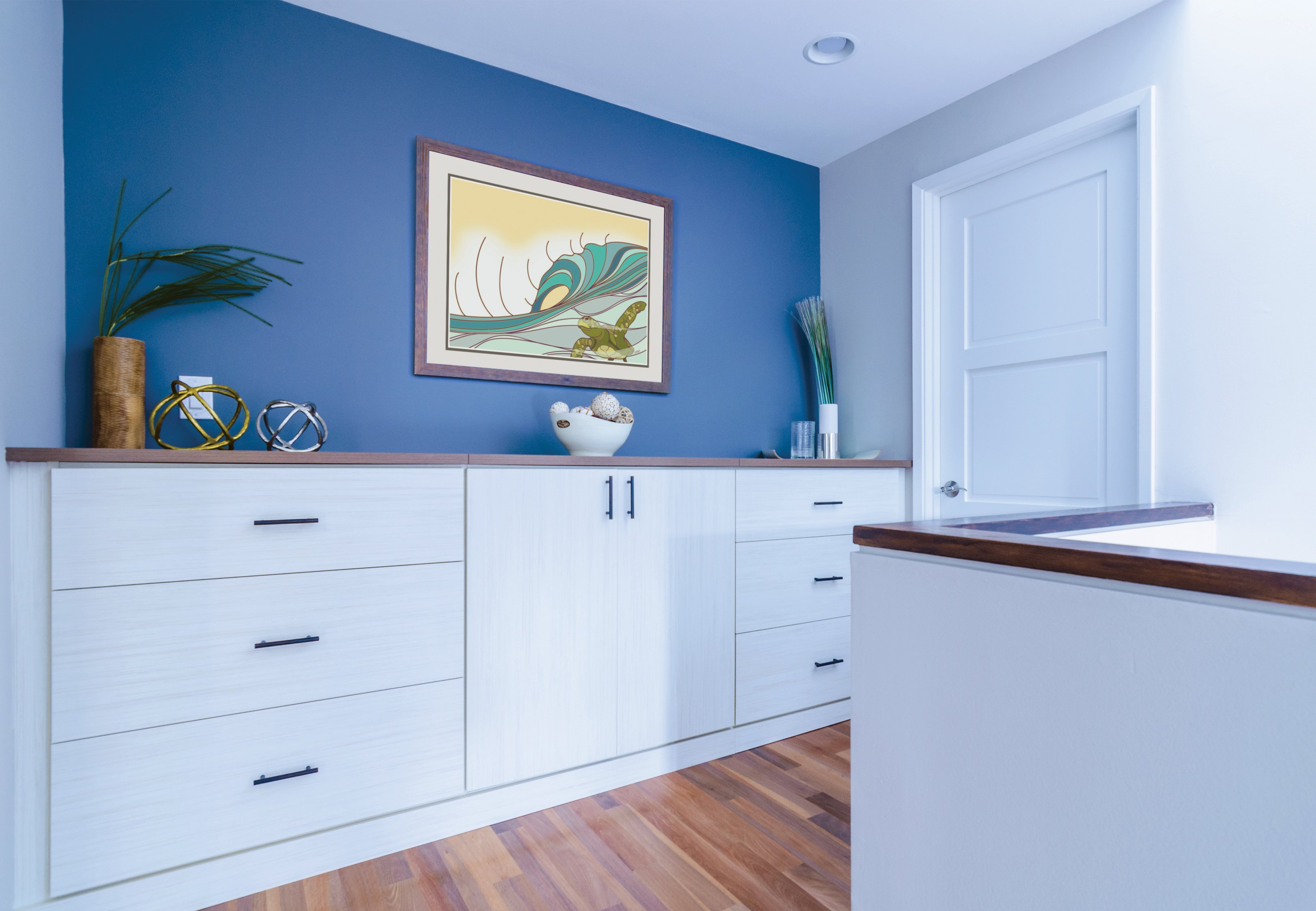 Hallway storage cabinets and drawers in classic white finish by California Closets Hawaii.
