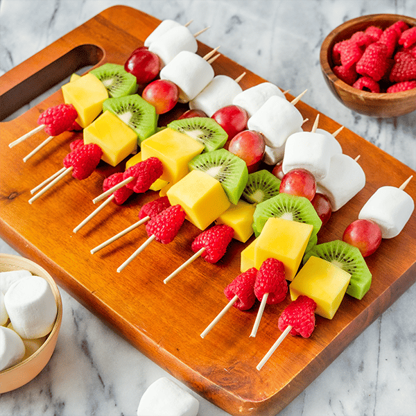 lucky rainbow fruit kabobs with marshmallow clouds
