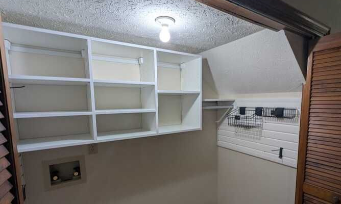 Virginia Beach - Custom closets -  Compact laundry or utility space with built-in shelving and hanging rods.