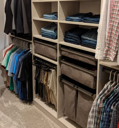 Walk-in closet with pull-out hampers and drawers
