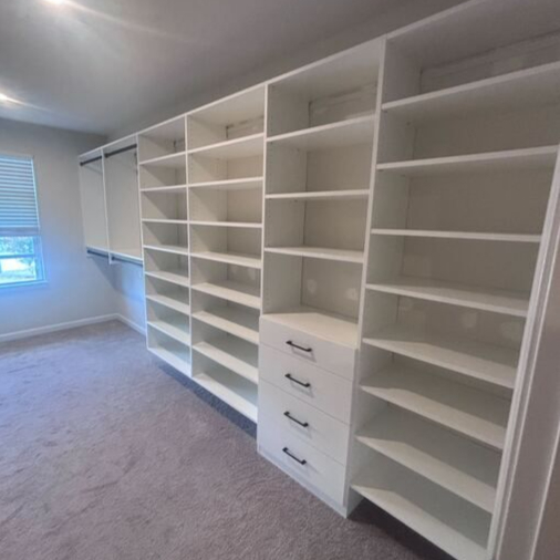 Virginia Beach - Custom closets - Expansive walk-in closet with shelving, drawers, and double hanging rods.