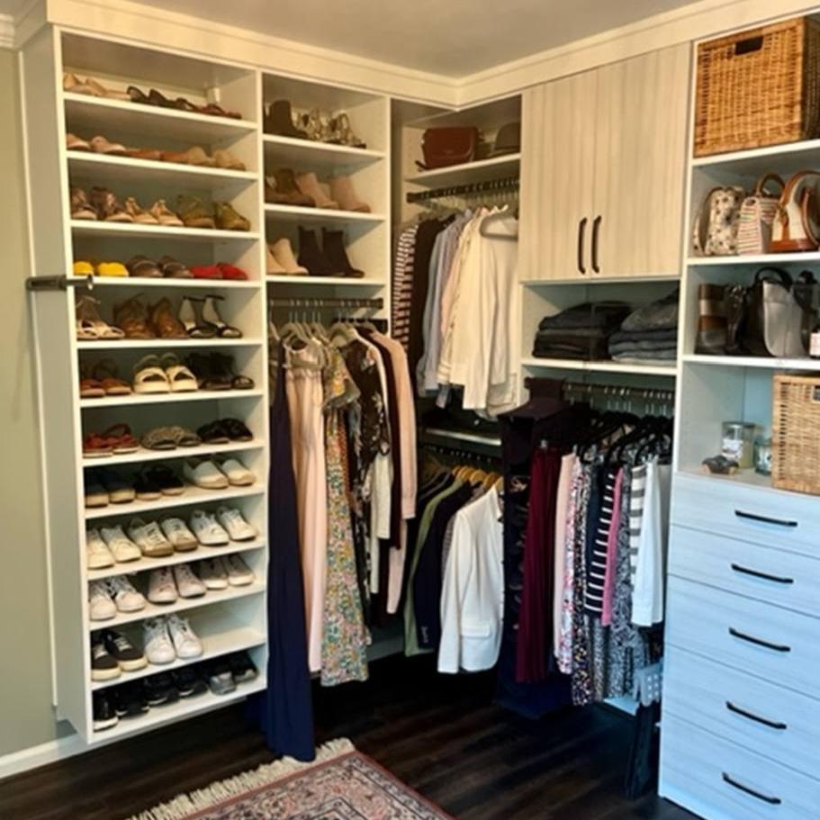 Richmond - Custom closets - Organized walk-in closet with shoe shelves, drawers, and a cabinet