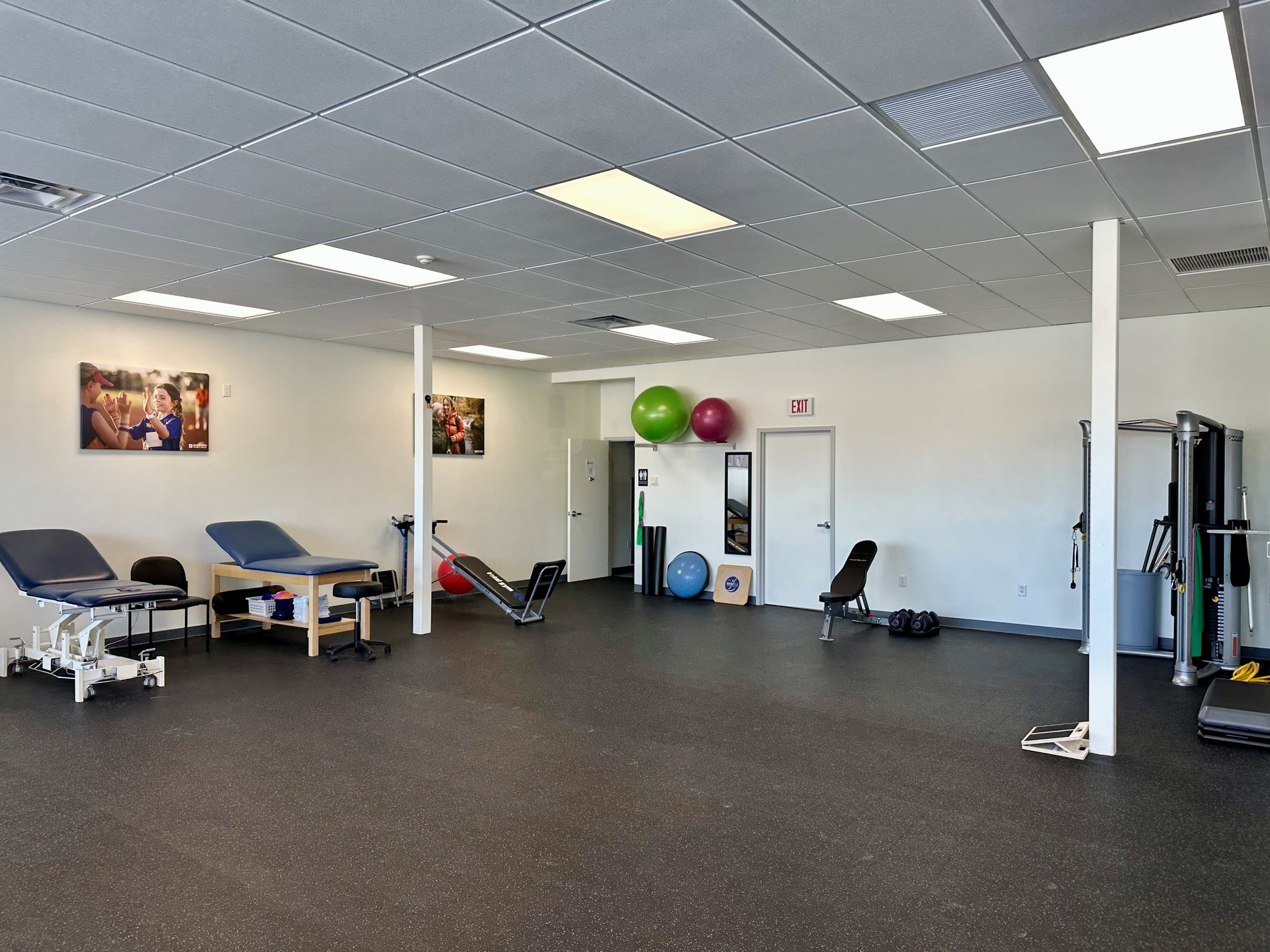 RI-NorthProvidence Bay State Physical Therapy patient care area with PT equipment.