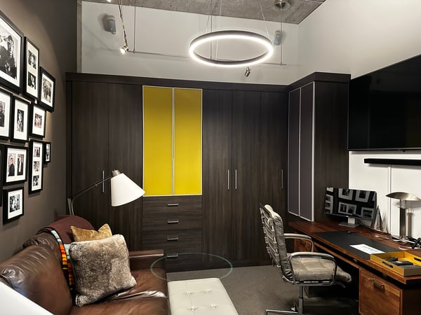 Multi-purpose room featuring an office space and multiple storage solutions by California Closets Toledo, Ohio.