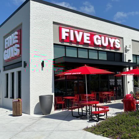 Exterior photograph of the Five Guys restaurant at 811 South Main Street in Rolesville, North Carolina.