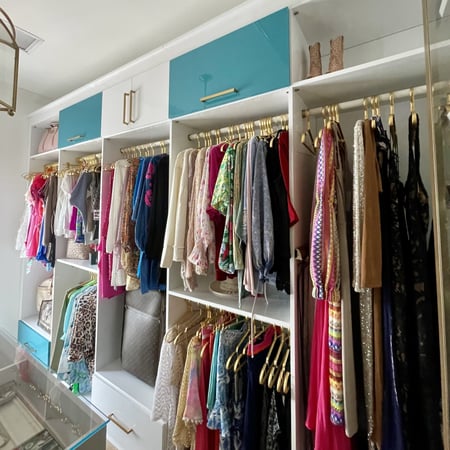 Glossy blue and white closet shelving for custom organization Pensacola & Panama City, Florida