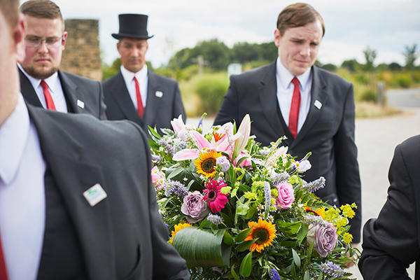 Funeral flowers placed on a coffin