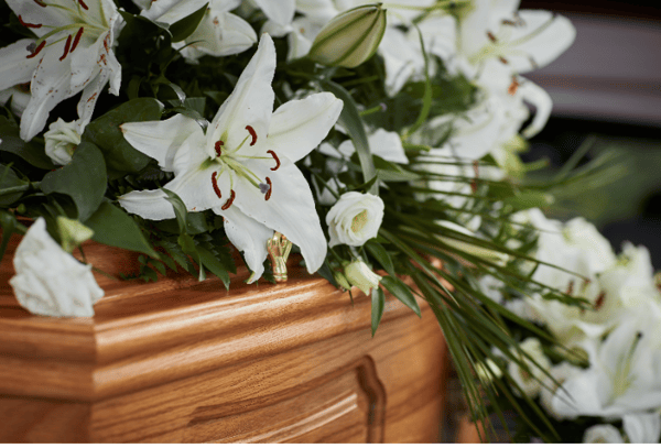 A coffin spray of lilies