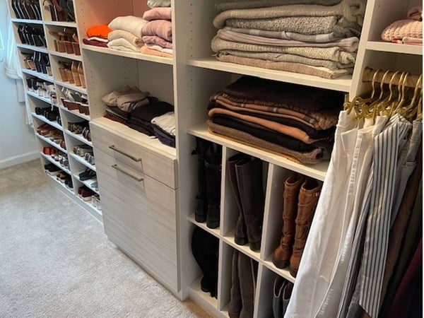 Richmond - Custom closets - Organized walk-in closet with neatly folded clothes