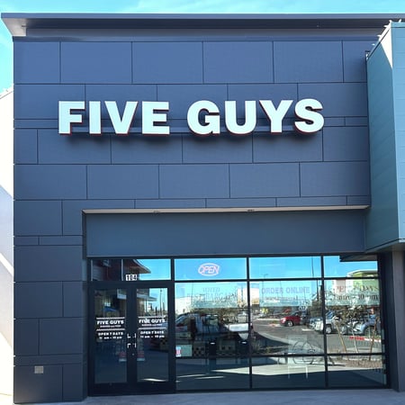 Exterior photograph of the Five Guys restaurant at 1045 North Verado Way in Buckeye, Arizona.