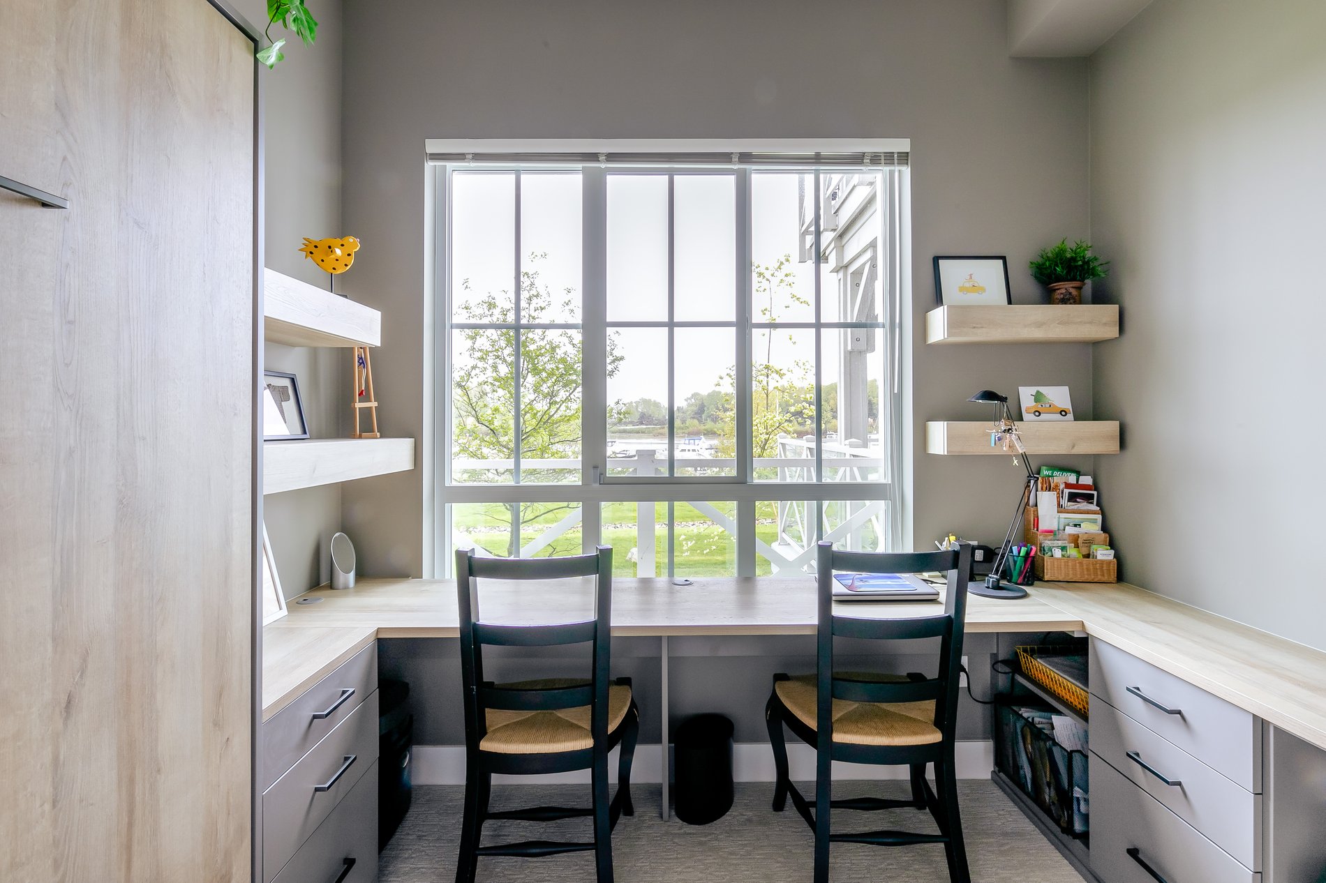 Office with custom desk, shelves and wall bed
