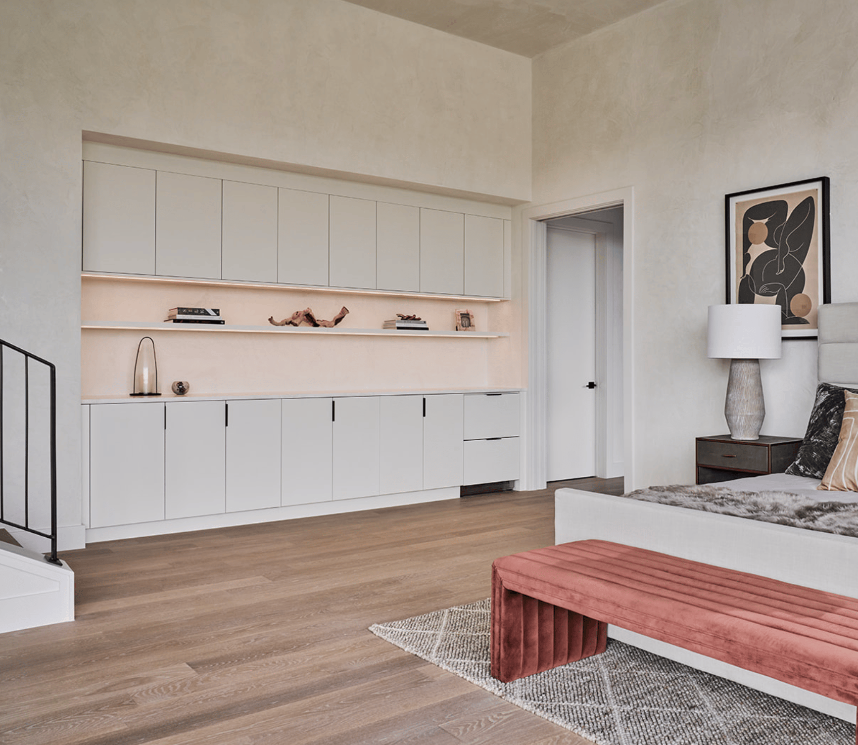 Modern minimalistic custom storage center in Austin by California Closets, featuring floating shelves with ample space. Perfect for an organized and stylish home setup.