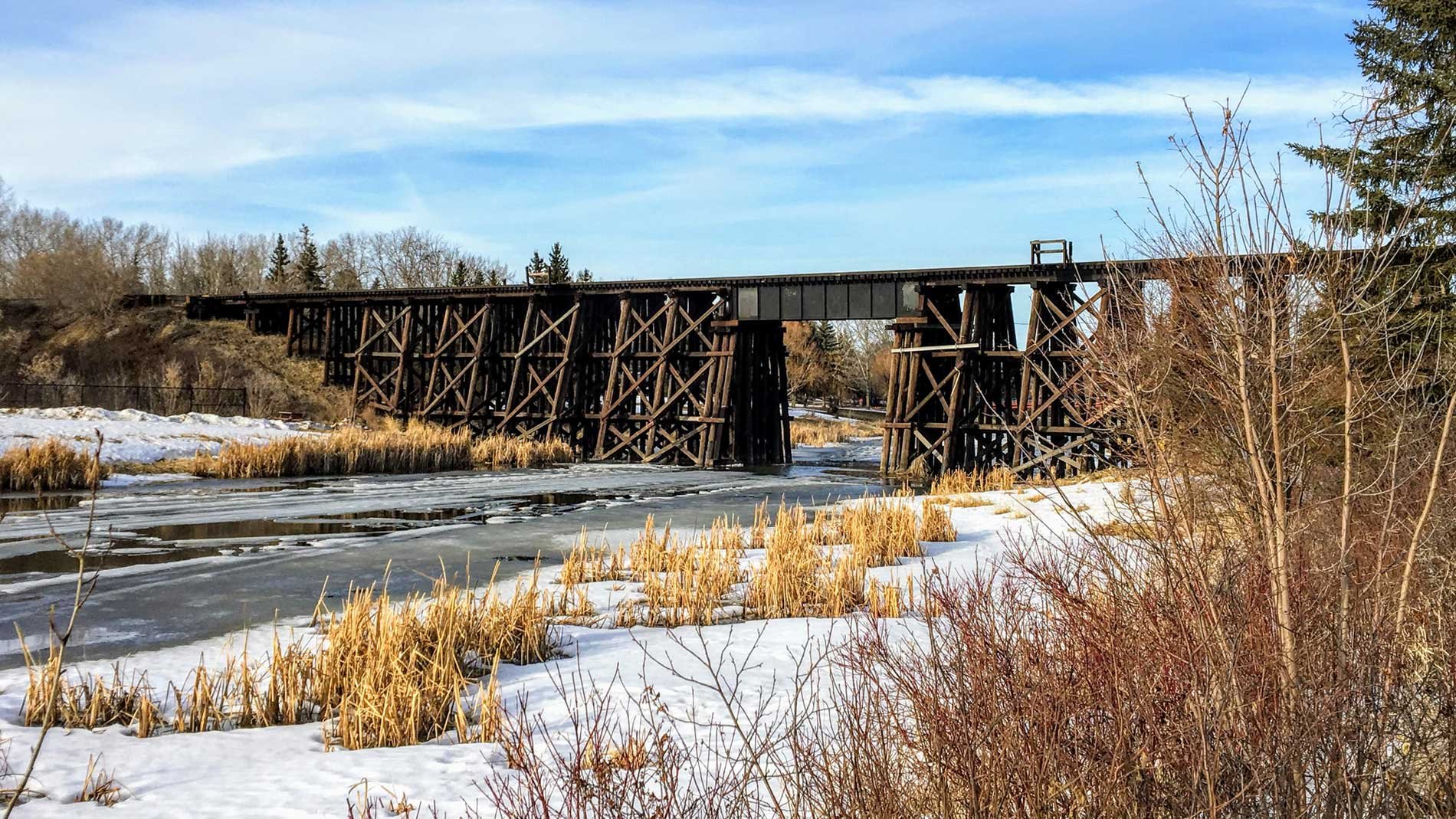 Wooden train bridge crossing the Sturgeon River in St. Albert, Alberta.