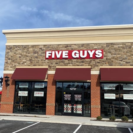 Exterior photograph of the Five Guys restaurant at 12737 Stone Village Way in Midlothian, Virginia.
