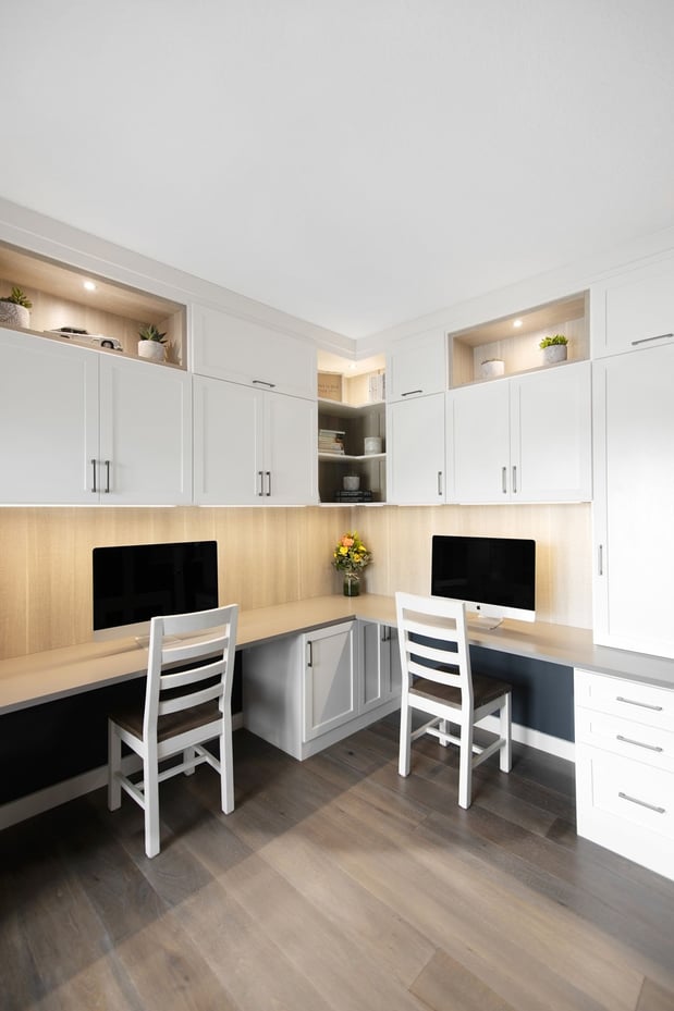 White and Gray Home Office with lower and upper cabinetry, two work stations, and display boxes.