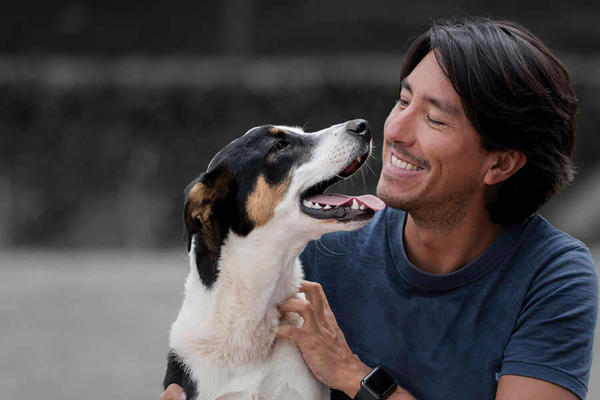 man looking adoringly at his dog