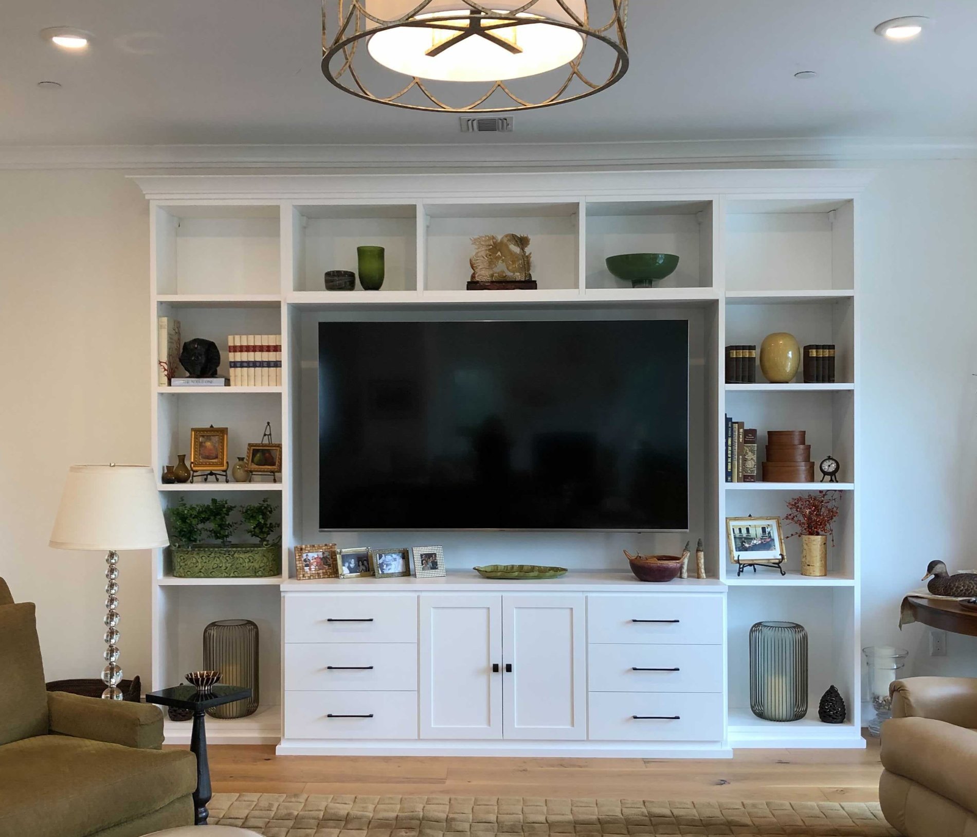 White media center with bookshelves and center TV