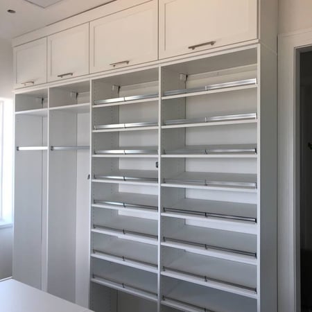Richmond - Custom closets - Shoe shelves and racks to hang clothes in a walk-in closet