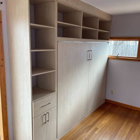 A wood-finish wardrobe complete with shelves for versatile storage.