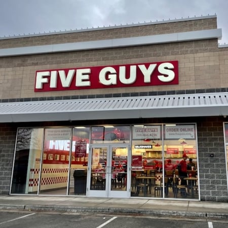 Exterior photo of the Five Guys restaurant at 16387 North Marketplace Boulevard in Nampa, Idaho.
