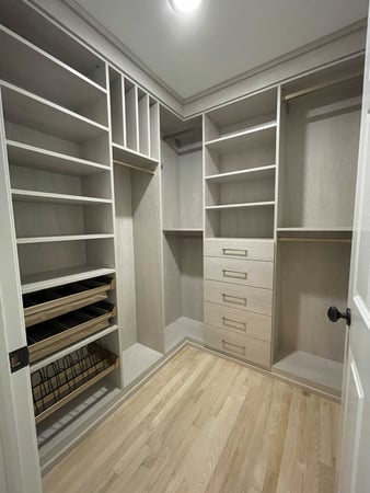 closet in grey color with shelves, drawers and pull out baskets and shoe racks