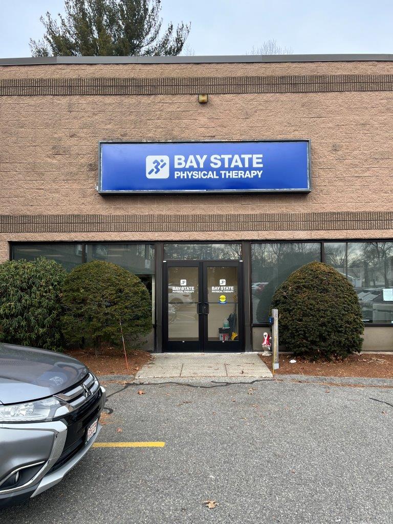Bay State Physical Therapy - Tewksbury 885 Main Street front doors with logo shown above doors.