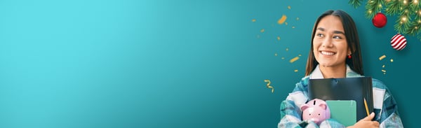 smiling female holding school supplies