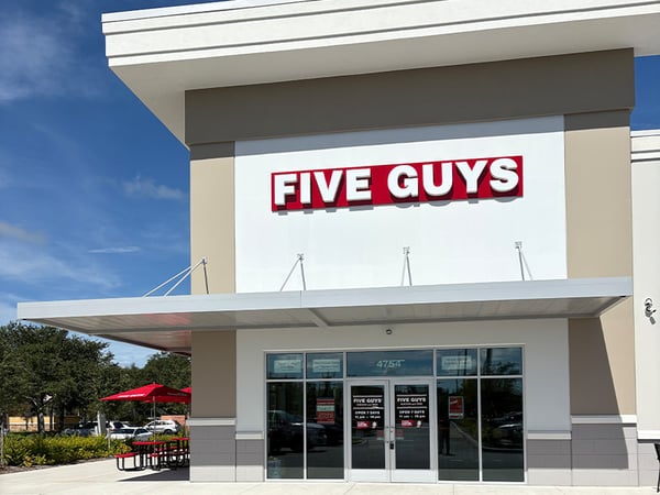 Exterior photograph of the Five Guys restaurant in Kissimmee, Fla.
