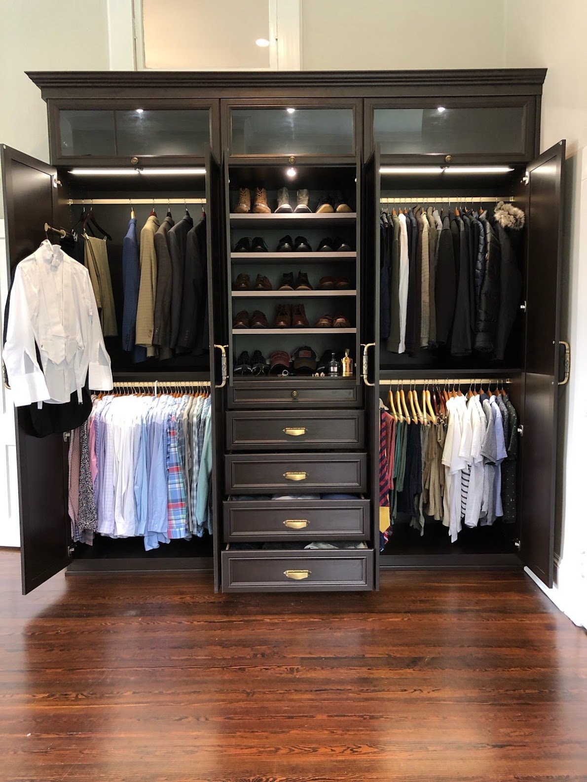 Brown armoire for closets with double hang and drawers California Closets Pensacola and  Panama City, Florida