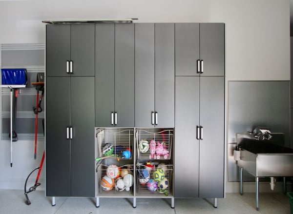 Garage storage with custom cabinets, drawers, and wire baskets by California Closets Greater Detroit, Michigan.