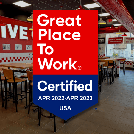 A graphic featuring the Great Place to Work® certification badge in front of the interior of a Five Guys restaurant.