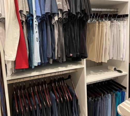 Men's walk in closet with double hang storage in different heights