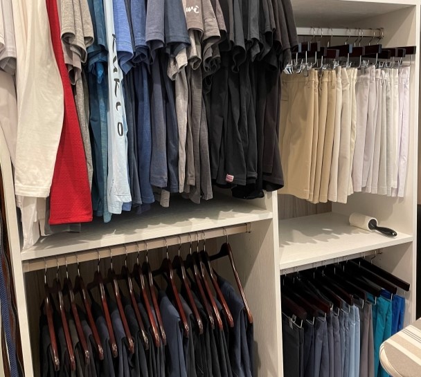 Men's walk in closet with double hang storage in different heights