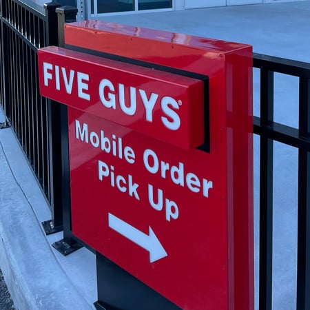 Directional signage for the mobile pickup window at the Five Guys at Posner Village in Davenport, Florida.