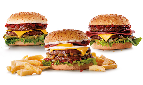 Three Wimpy beef burgers behind a serving of chips on a white plate.
