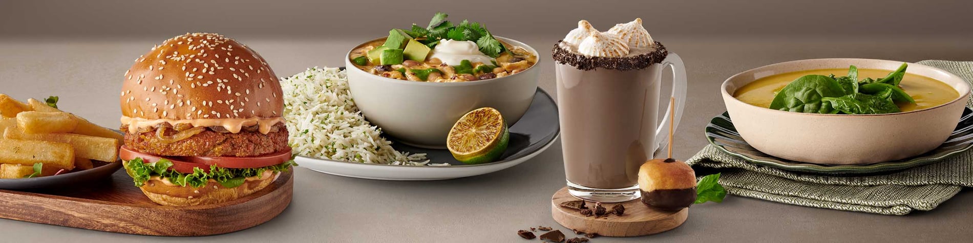 New meals from Mugg & Bean including a Marshmallow Cookies & Cream Hot Chocolate, a Creamy Chicken & Bean Chili Bowl, a Veggie Gourmet Burger, and a Red Lentil Coconut Soup.